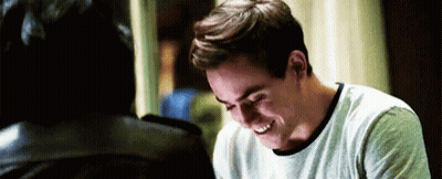 Man In White Shirt Laughing Next To Another Man GIF
