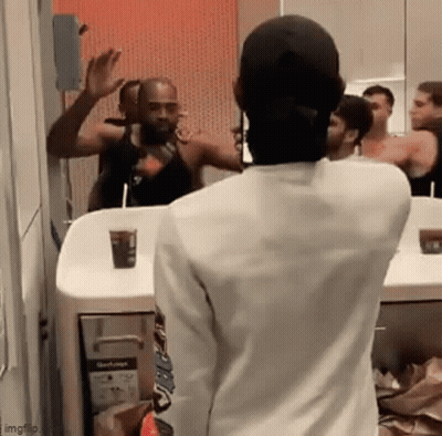 Man In White Shirt Looking In Mirror GIF