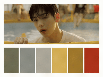 Man In White Shirt Looking Over Yellow Fence GIF