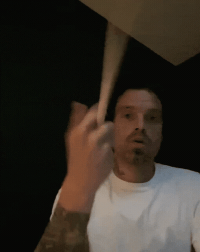 Man In White Shirt Making Face With Hand GIF