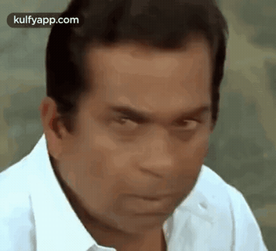 Man In White Shirt Making Funny Face Eyes Closed GIF