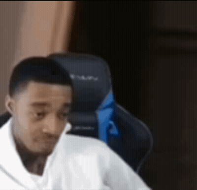 Man In White Shirt Making Funny Face In Gaming Chair GIF