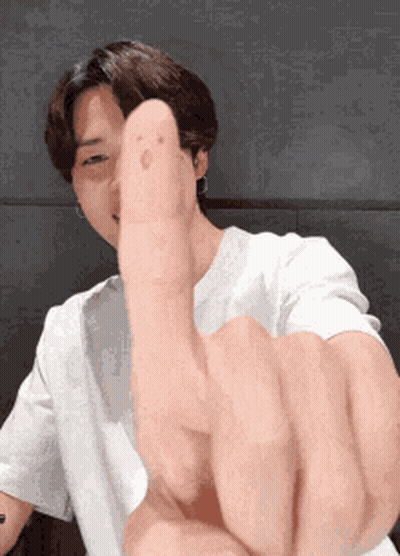 Man In White Shirt Making Peace Sign GIF