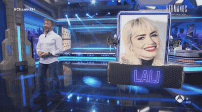 Man In White Shirt Near Lali Sign GIF