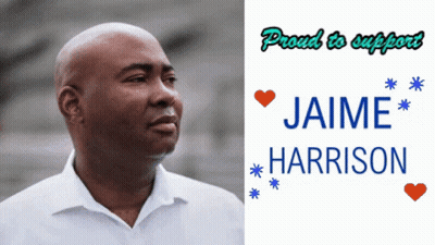 Man In White Shirt Next To Jaime Harrison Sign GIF