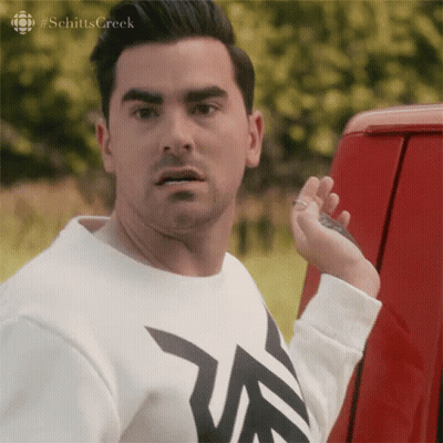 Man In White Shirt Next To Red Truck GIF