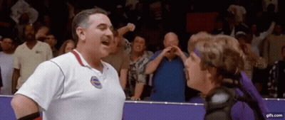 Man In White Shirt Next To Woman In Purple Headband GIF