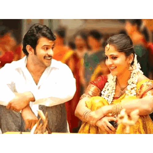 Man In White Shirt Next To Woman In Yellow Sari Sticker