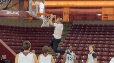 Man In White Shirt Number 13 Jumping Into Basketball Hoop GIF