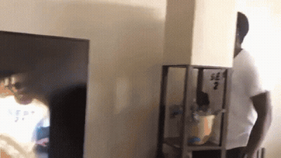 Man In White Shirt Number 2 In Front Of TV GIF