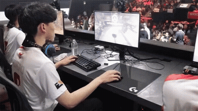 Man In White Shirt Number 2 Playing Video Game GIF
