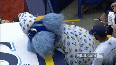 Man In White Shirt Number 35 Next To Mascot GIF