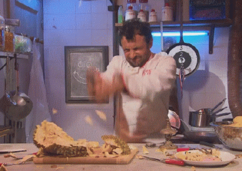 Man In White Shirt Number 99 In Kitchen GIF