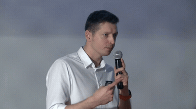 Man In White Shirt Pointing At Microphone GIF