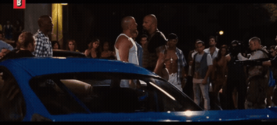 Man In White Shirt Pointing Gun At Camera Letter B GIF