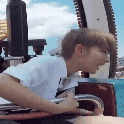 Man In White Shirt Riding Roller Coaster GIF
