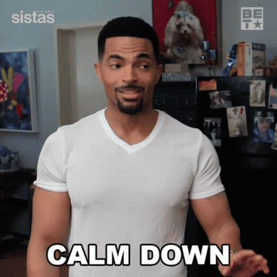 Man In White Shirt Saying Calm Down GIF