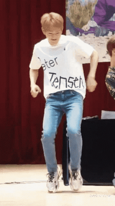 Man In White Shirt Saying Peter Tensen Dancing On Stage GIF