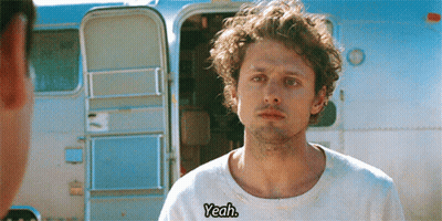 Man In White Shirt Saying Yeah In Front Of Trailer GIF