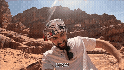 Man In White Shirt Says Let's Go In Desert GIF