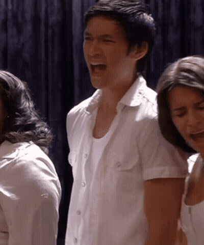 Man In White Shirt Screaming Beside Woman GIF