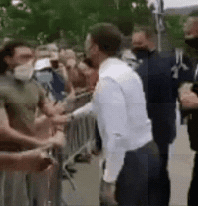 Man In White Shirt Shaking Hands GIF