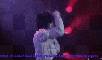 Man In White Shirt Singing Baby I'm A Star Take A Picture Baby GIF