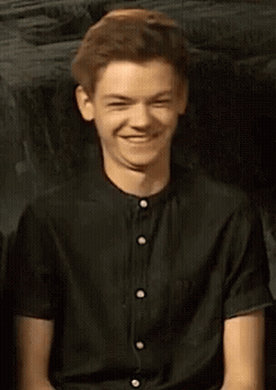 Man In White Shirt Singing Into Mic Making Funny Face GIF