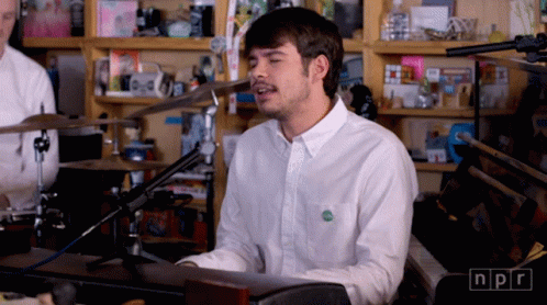 Man In White Shirt Singing Into Microphone NPR GIF