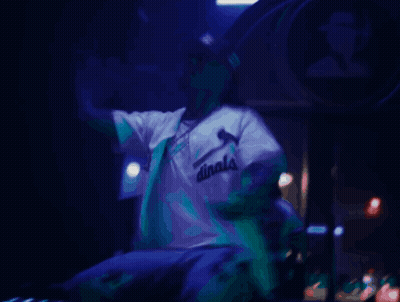 Man In White Shirt Singing Into Microphone Saying Dinals GIF