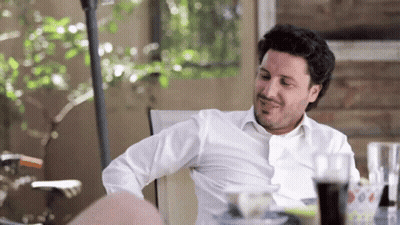 Man In White Shirt Sitting At Table With Coke GIF