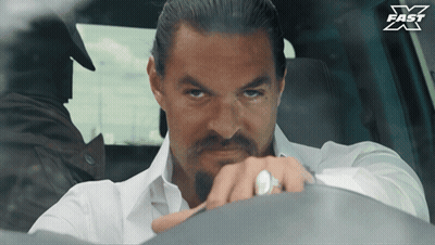 Man In White Shirt Sitting In Car With X Fast Logo GIF