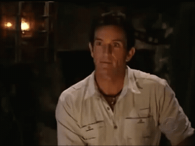 Man In White Shirt Sitting In Dark Room Eyes Closed GIF