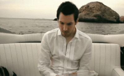 Man In White Shirt Sitting On Boat GIF