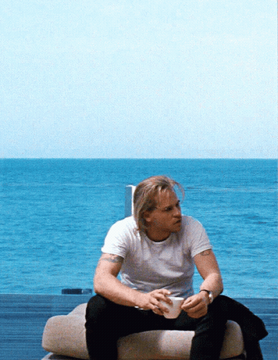 Man In White Shirt Sitting On Couch GIF