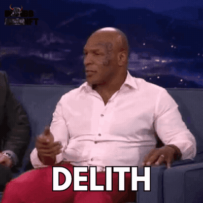 Man In White Shirt Sitting On Couch With Delith GIF