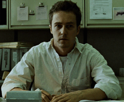 Man In White Shirt Sitting With Calculator GIF