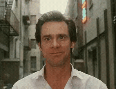 Man In White Shirt Smiling In Alley GIF