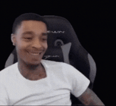 Man In White Shirt Smiling In Chair GIF