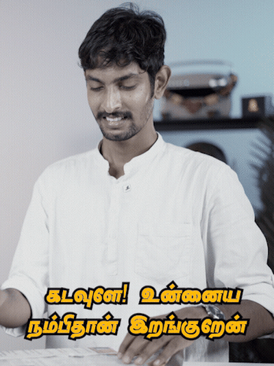 Man In White Shirt Smiling In Front Of Kalvan Sign GIF