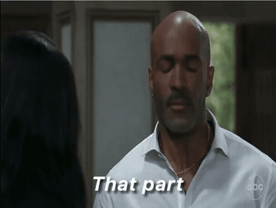 Man In White Shirt Speaking To Woman With Eyes Closed GIF