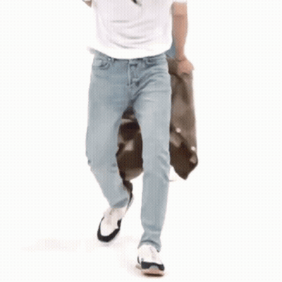 Man In White Shirt Squatting Next To Bag GIF