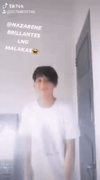 Man In White Shirt Standing Before Door Saying Nazarene Brillantes Lng Malakas GIF