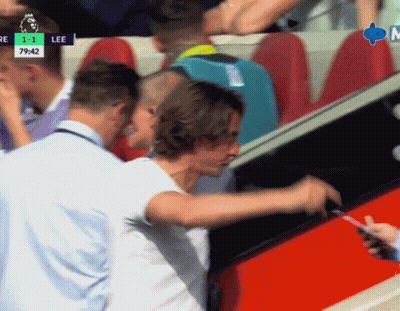 Man In White Shirt Standing Before Lee Screen GIF