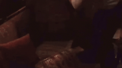 Man In White Shirt Standing In Dark Room GIF