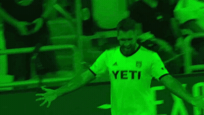 Man In White Shirt Standing In Front Of Toyota Sign GIF