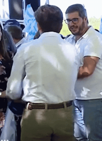 Man In White Shirt Talking To Man In Glasses GIF