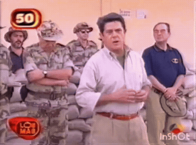Man In White Shirt Talking To Soldiers GIF