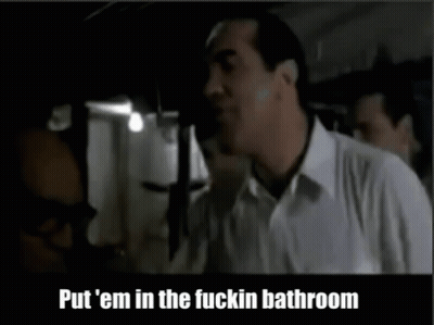 Man In White Shirt Telling Put Em In Bathroom GIF