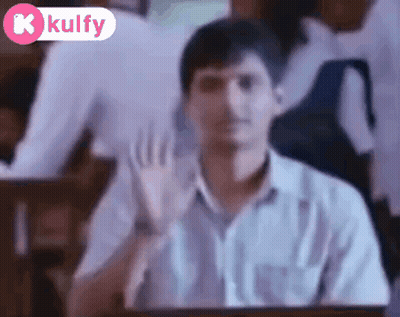 Man In White Shirt Waving In Classroom GIF
